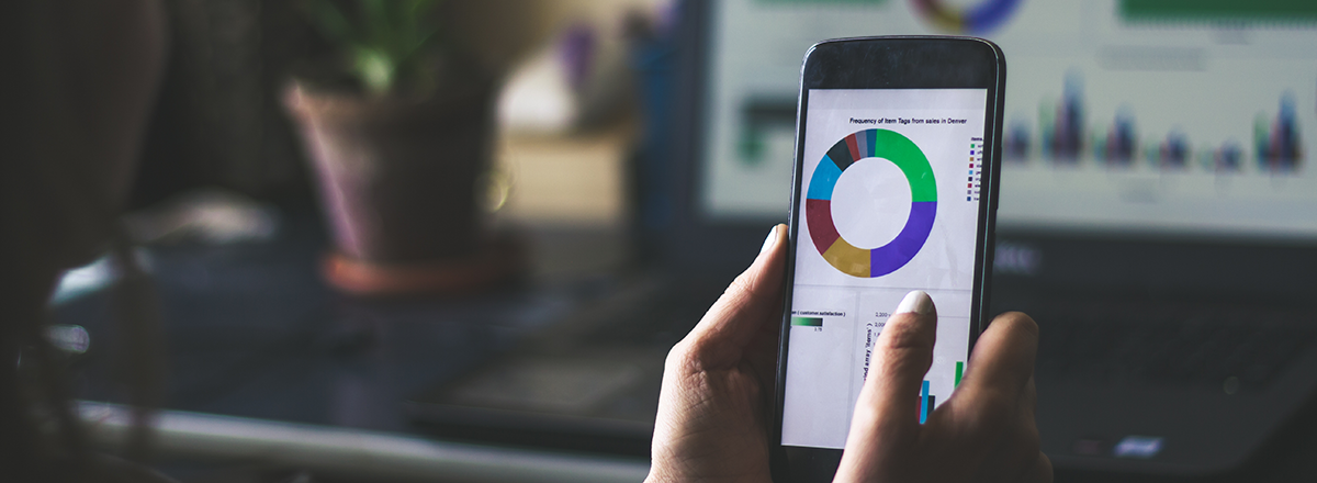 Woman looking at a chart on her phone.